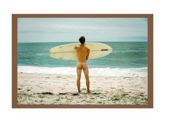POSTCARD / Surfer nude on beach looking at horizon