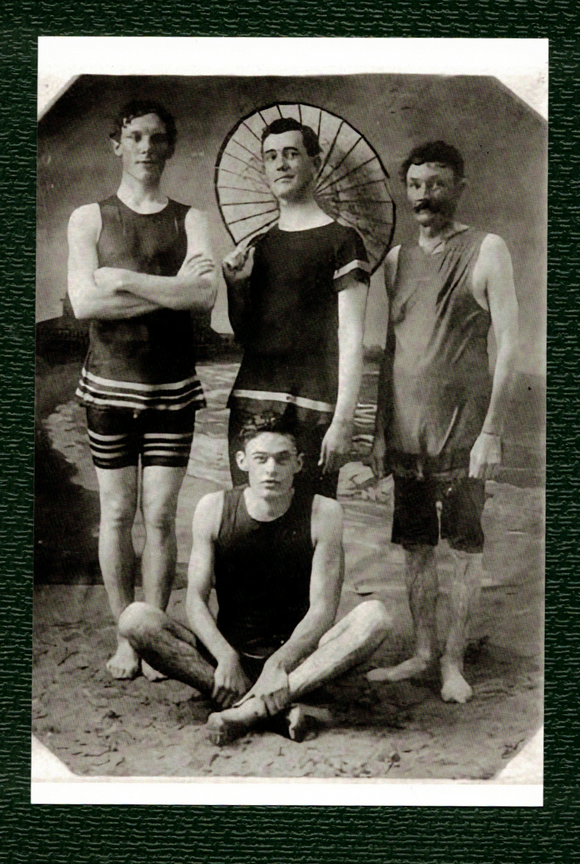 POSTCARD / Group of men in swimsuits in studio, 1910s