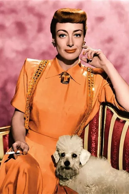 POSTCARD / Joan Crawford in orange dress + dog, 1941