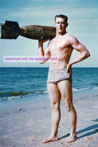 POSTCARD / Man in swimsuit holding torpedo