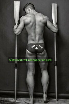 POSTCARD / Lifeguard holding oars